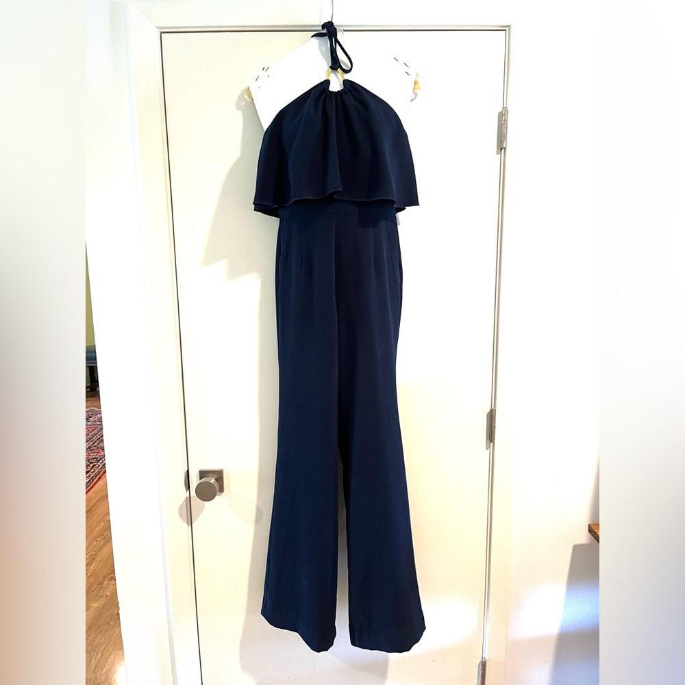 Navy TrinaTurk jumpsuit with gold hardware.  Crepe fabric only worn once.